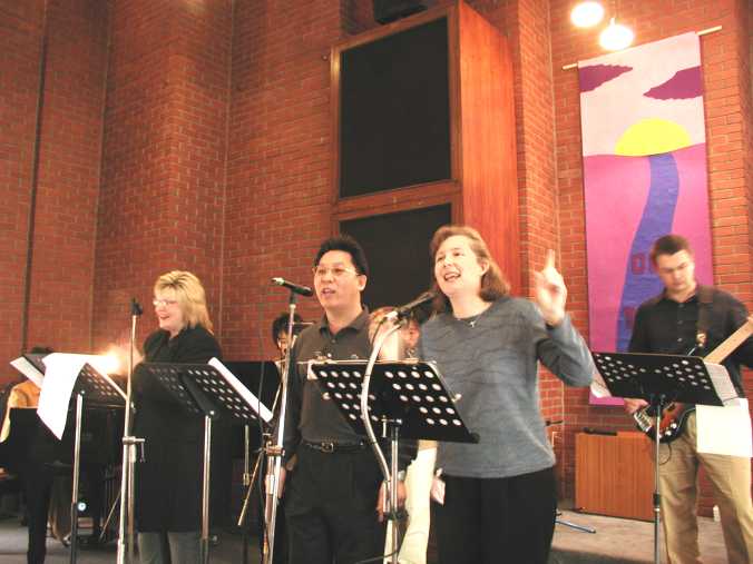 Praise Team leads the congregation in an energetic spiritual time of worship, singing contemparary praise songs.